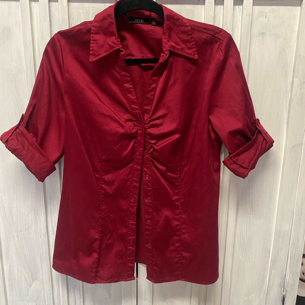 Very pretty deep red button up blouse and well made. Like new size (Large)